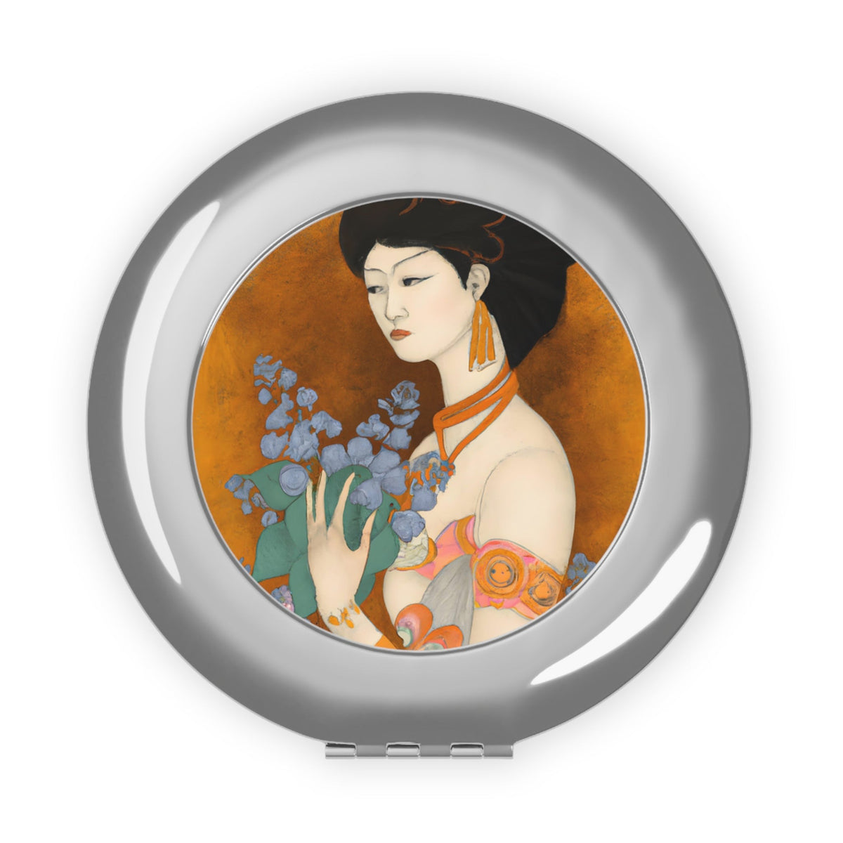 front view of a compact mirror with a painted image of a Geisha holding some violets