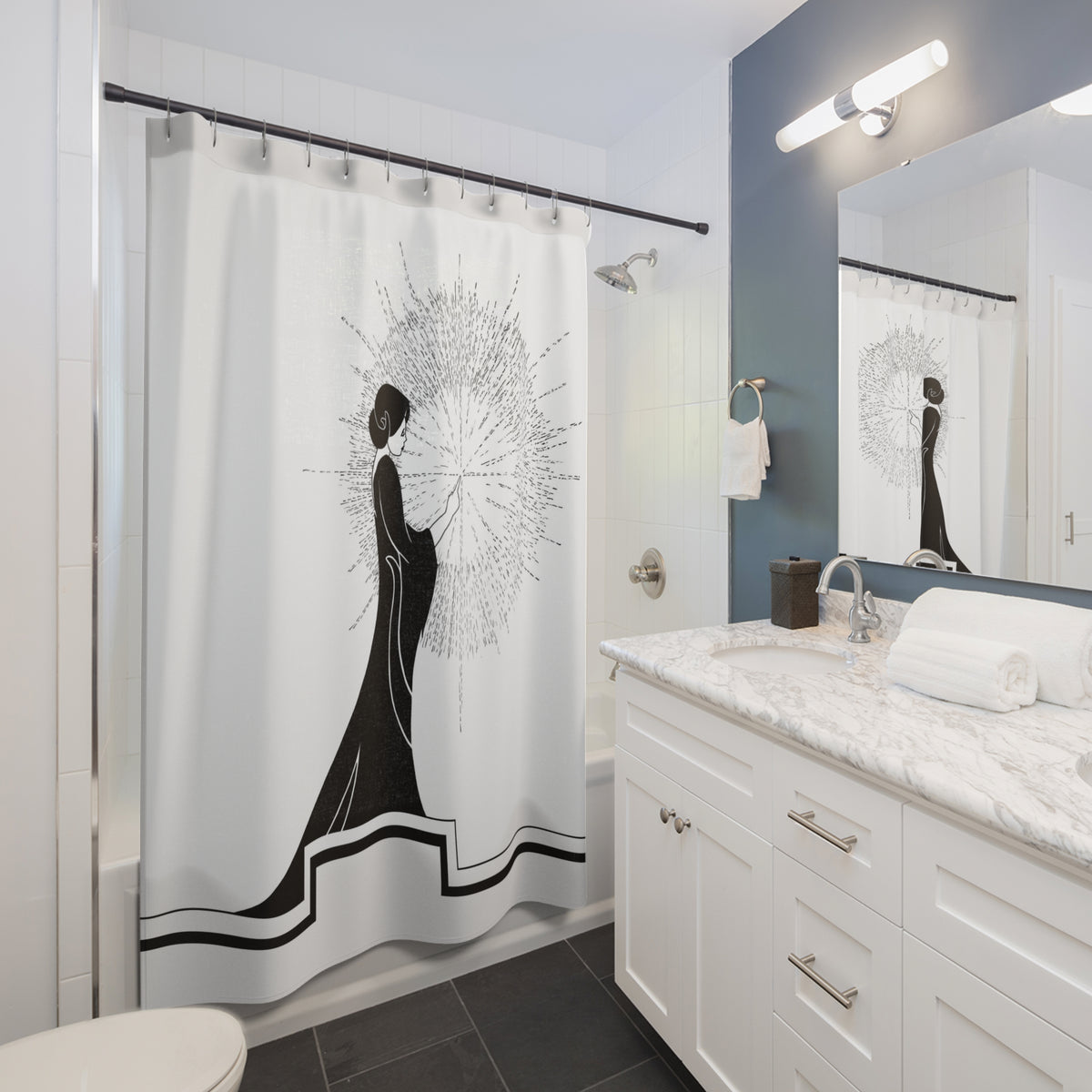 bathroom view showing a shower curtain design of an ink drawing of a woman touching the spark of creation in an Art Deco style