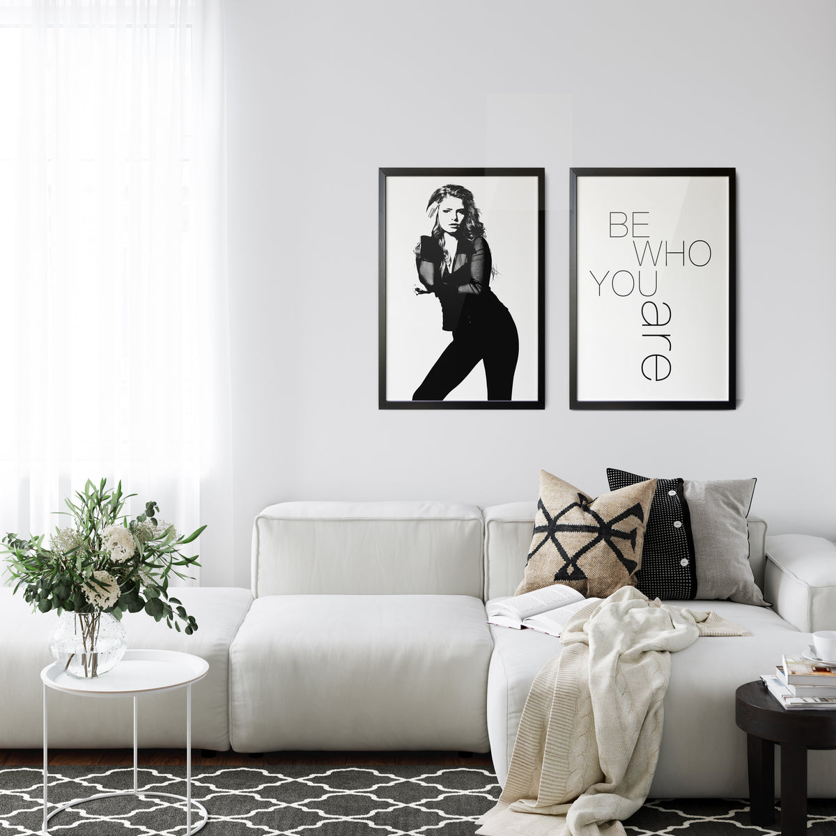 Livingroom with 2 framed images, one with girl in BW and one with words Be Who You Are