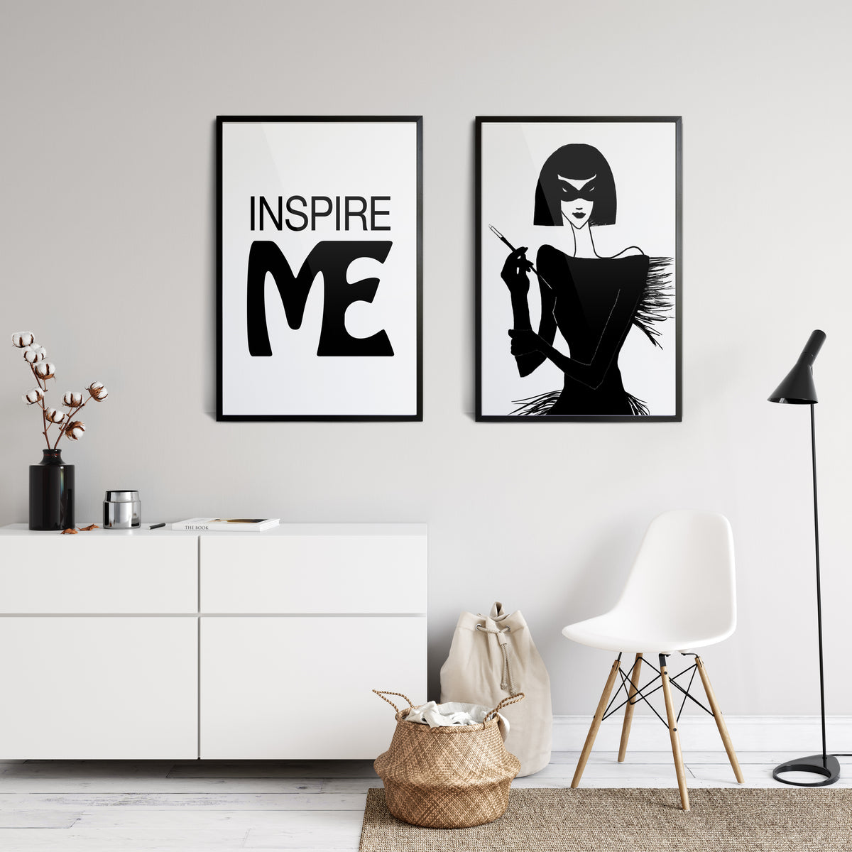 interior room view with  Black on white poster print saying INSPIRE ME next to an ink drawing of a 1920's woman holding a cigarette on a stick 