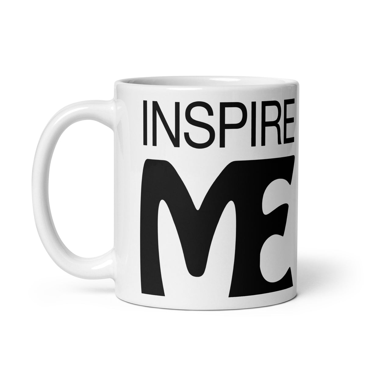 view of a black and white mug that says "inspire me"