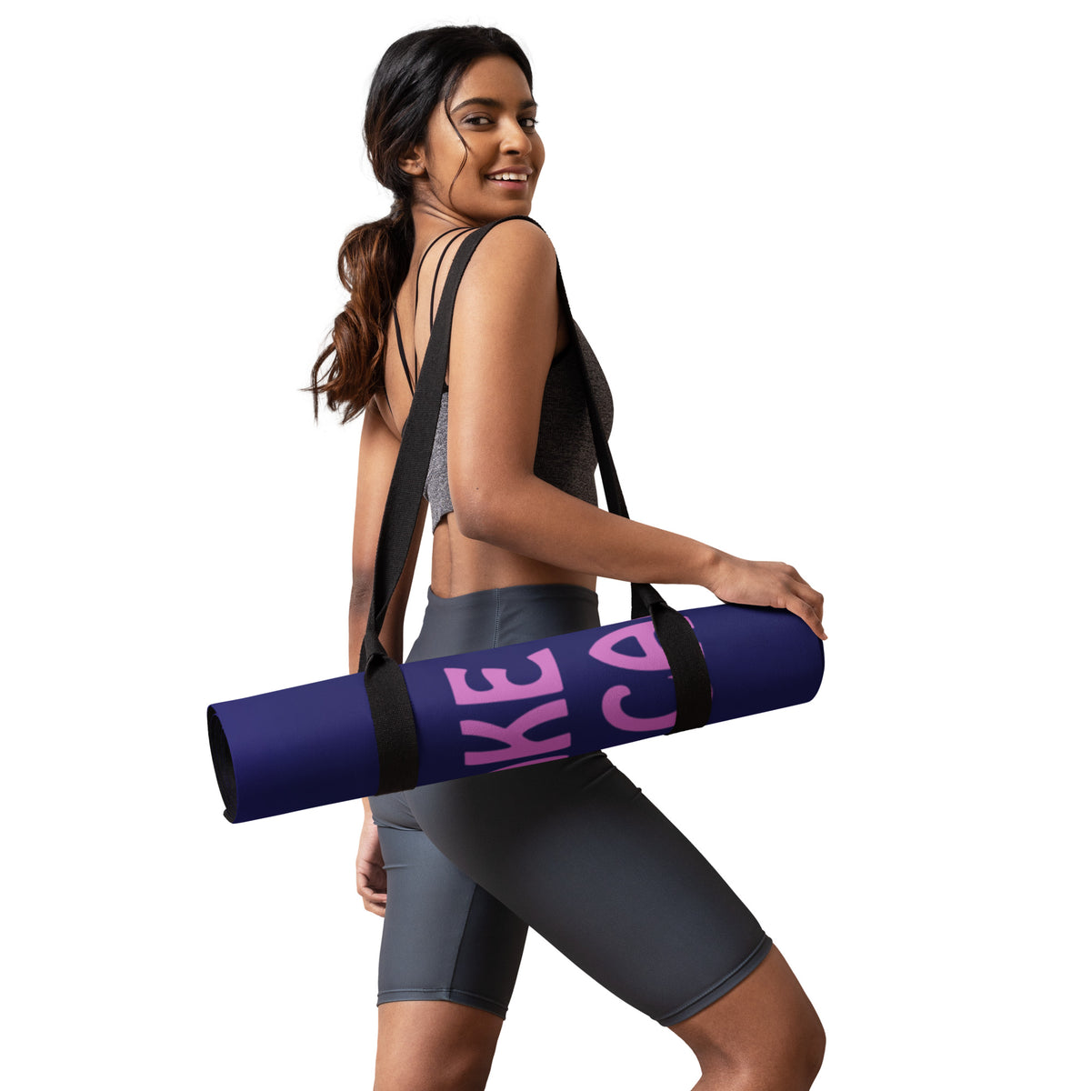 sporty woman carring a rolled up Yoga mat with a purple wrap and an image of a young woman in sunglasses. There is pink text that reads Make Me An Offer I Can't Refuse