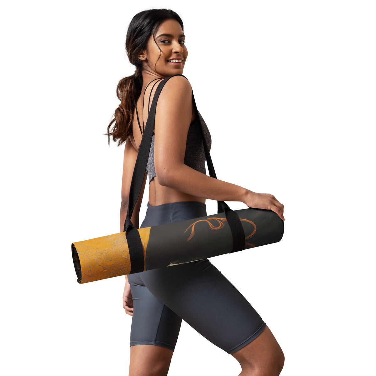 sporty woman with a rolled up Yoga Mat with a painted image of a Geisha holding some violets
