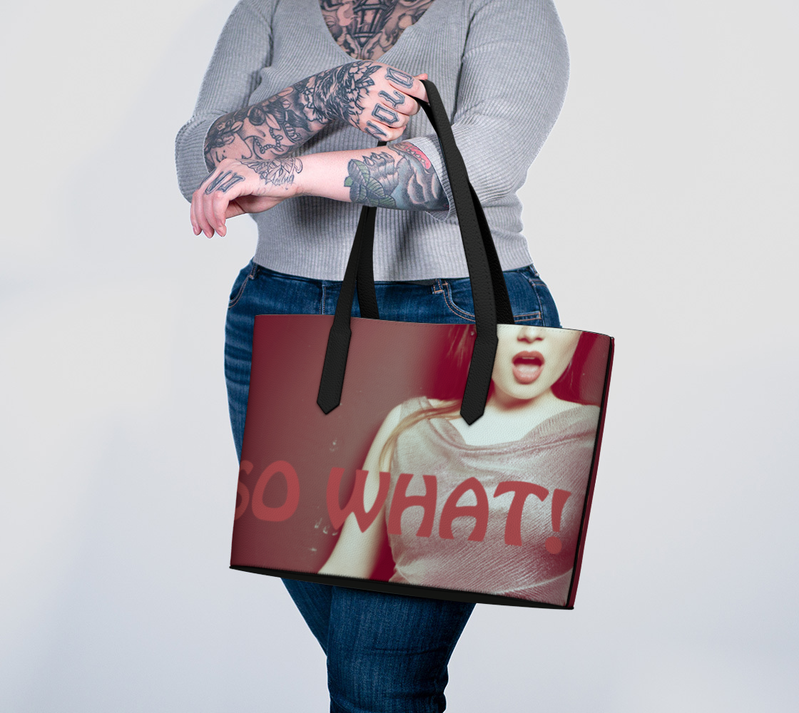 Girl holding Vegan Leather Tote Bag with design of girl and "So What!" quote