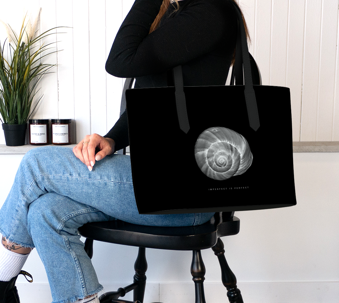Girl holding Vegan Leather Tote Bag with shell and "Imperfect is Perfect" quote