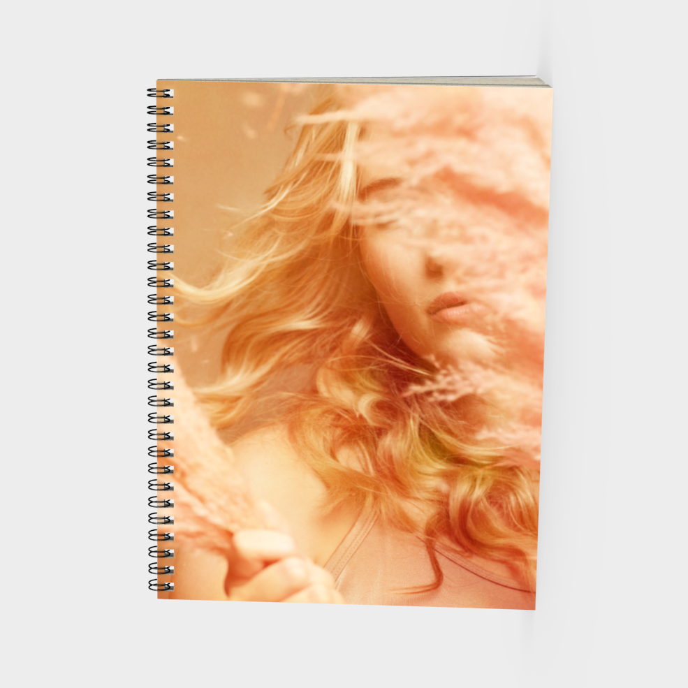 spiral bound note book of Fine art print of a young blonde girl holding pink fluffy plumes